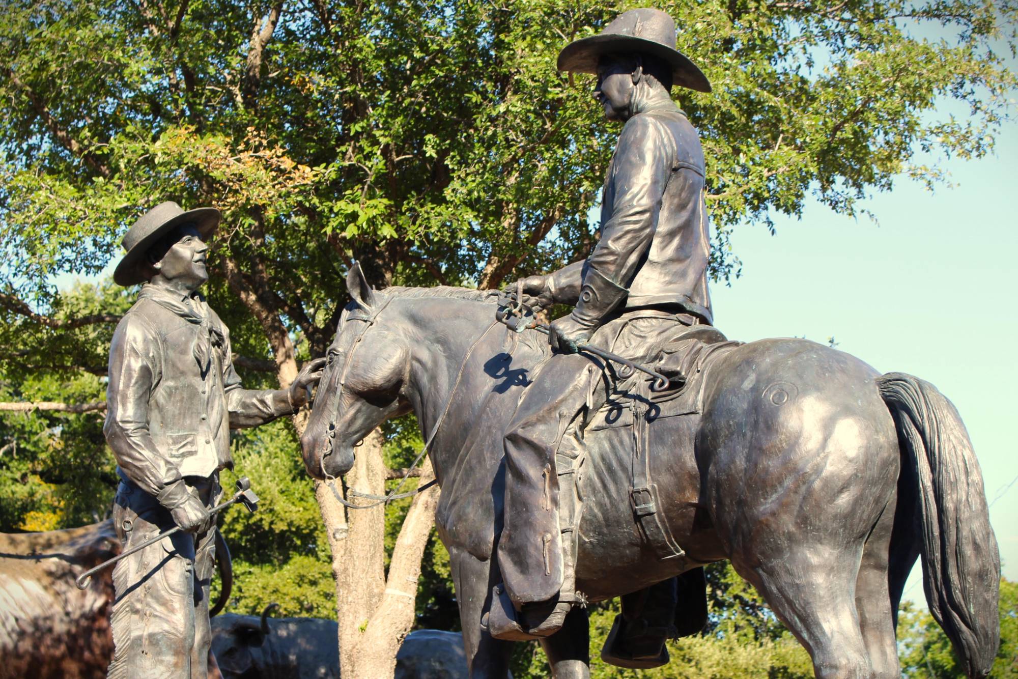 Cowboy on horseback bronze statue at Chisholm Trail Crossing in Round Rock