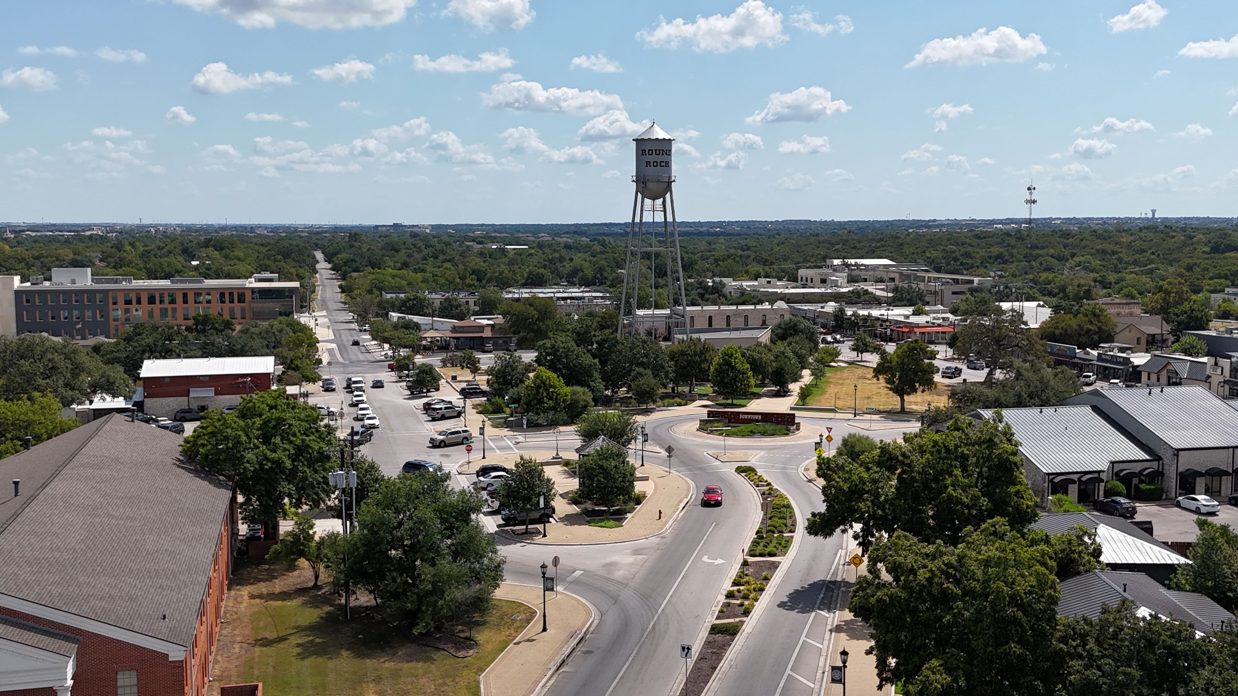Drone aerial view over an Austin neighborhood served by Parrot Overhead